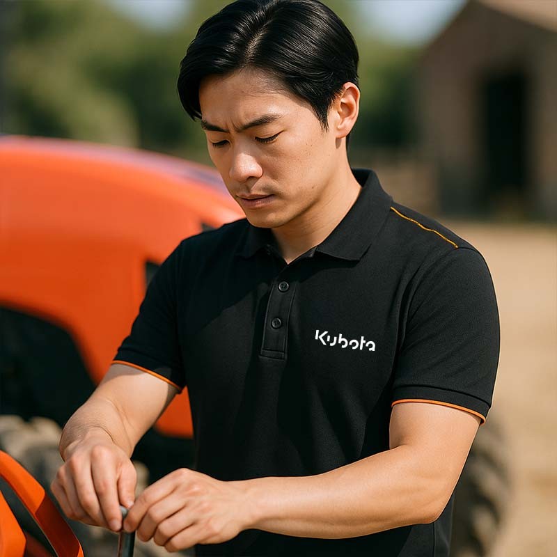 Boutique Officielle Kubota | Polo Kubota homme noir et orange